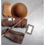 Civilian's tin helmet, razor set, crop and various leather leggings.