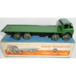 Dinky. 502 Foden flat truck. 1947-8, 1st type cab. Green/silver/black green. Average condition.