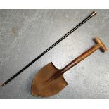 Entrenching tool and silver topped cane.