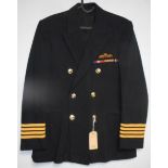British Navy dress uniform black jacket with Peter Brough of London label having BEA buttons,