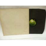 The Beatles, White Album, numbered sleeve 0557854. With black inners 'sold in the U.K.' text, top
