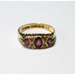 18ct gold ring with three amethysts and diamond points, Chester 1912, size Q, 3g.