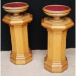 Pair of octagonal pine columns, each with moulded top and plinth base and collection bowls, 73cm