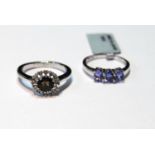 Tanzanite three-stone ring and another, smoky quartz, in 9ct white gold, sizes N and P.   (2)