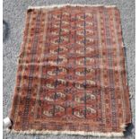 Afghan rug with two rows of ten guls over red ground and geometric border, 135cm x 93cm.