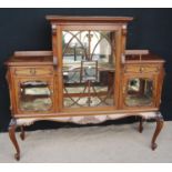 Late 19th century mahogany display cabinet, the projected cornice over stepped top, glazed door