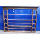 18th century oak and pine plate rack, the projected moulded cornice over open shelves, 153cm wide,