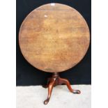 George III mahogany birdcage tilt-top table, the circular top raised on tapering turned support,