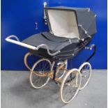 Silver Cross pram in dark blue with chrome fittings, 153cm long, 126cm high and 55cm wide.