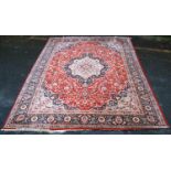 Bunyan carpet, all over floral design, central cream medallion over red ground, spandrels and