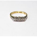 Diamond three-stone ring '18ct Plat' illusion-set, size Q½.