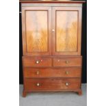 Late 19th century mahogany linen press, the projected moulded cornice over panelled doors