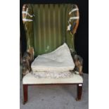 19th century mahogany lug chair with stuff-over frame, raised on square legs and brass castors, 75cm