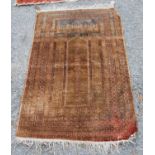 Prayer mat with triple mihrab panel over mihrab, group border, faded red ground, 137cm x 68cm.