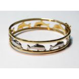 Coloured gold openwork hinged bangle with leaping dolphins, '585', 20g.