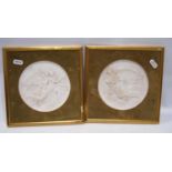 Pair of relief plaques depicting angels, 14cm diameter.