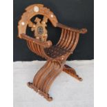 Late Victorian Syrian Savonarola chair, the elaborate carved back with turned centre, the whole