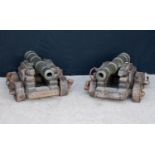 Pair of French iron cannons, each with carriage, 100cm long and 46cm high.