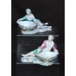 Pair of Meissen sweetmeat dishes in the form of reclining male and female figures in 18th century