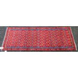 Mir Serabend rug with all over floral boteh design over red ground and double border, 154cm x 58cm.