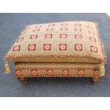 Large contemporary ottoman footstool with loose cushion, raised on tapering turned legs