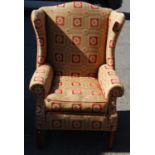 Wing back armchair with loose cushion seat, raised on reeded square legs united by stretchers,