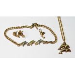 9ct gold bracelet with dolphins, two similar pendants and a pair of earrings, 5.4g.