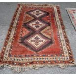 Eastern rug with triple diamond with dogtooth border, spandrels and quadruple border, 186cm x 130cm.