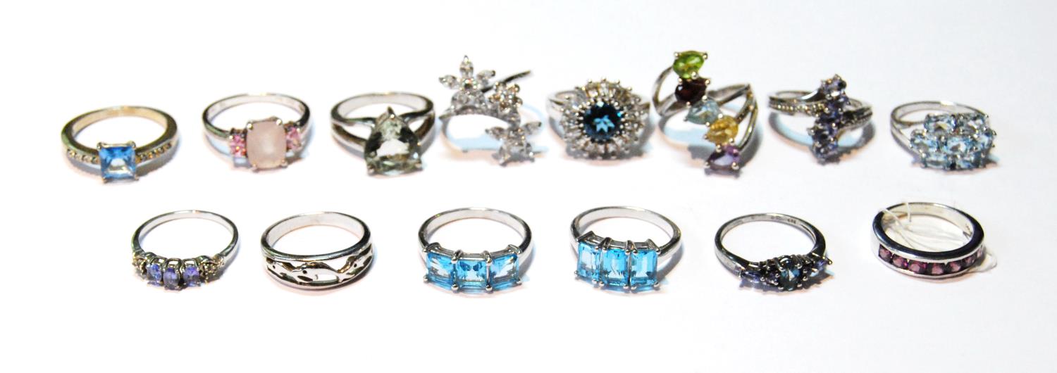 Fourteen silver gem rings, various.