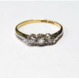 Diamond three-stone ring '18ct Plat', size Q½.
