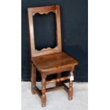 Early 18th century oak high back joint chair, the open back over moulded seat and raised on block