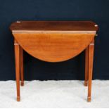 Mahogany Pembroke table, the oval drop flap top over frieze drawer, raised on square tapering legs