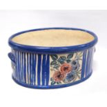 Studio pottery planter of oval form decorated by Ann McBeth with blue stripes and foliate panels,