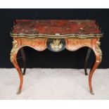 19th century Boulle work card table, the serpentine hinged top enclosing baize lining over ormolu