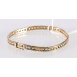 9ct gold bracelet with central band of interspersed rose gold, white gold and yellow gold textured