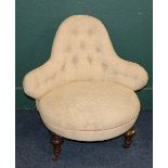Victorian ladies chair with bell shaped back upholstered in floral patterned fabric raised on turned