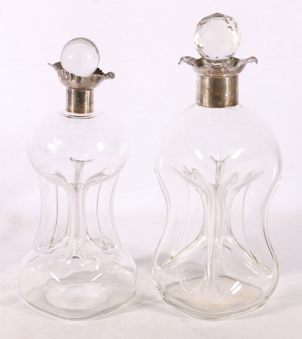 Two Victorian silver mounted decanters of waisted hour glass form, one collar by Hukin & Heath (John