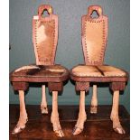 Pair of taxidermy and rosewood stools, the legs formed form deer legs and upholstered in deer