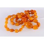 Graduated strand of amber style beads