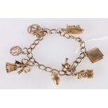 9ct gold curb link charm bracelet with nine dependant charms including Aladdin's Lamp, Bible, Acorn,
