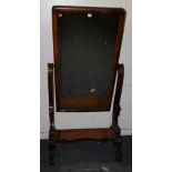 Victorian mahogany cheval mirror with scroll and tulip supports raised on castors, 166cm tall