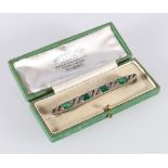 Art Deco style white metal white stone and green stone brooch, 7cm long in Fenton Russell and Co Ltd
