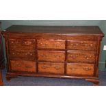 Antique oak sideboard, the crossbanded top with moulded edge above an arrangement of cupboards and