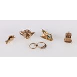 Five 9ct gold hallmarked charms including One Arm Bandit, Teapot, Rings, Shoe and enamelled St