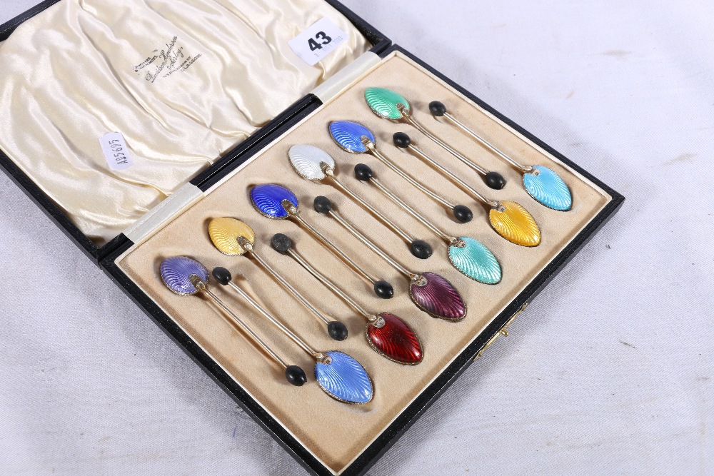 Set of twelve Art Deco silver gilt and enamel coffee spoons with coffee bean finials by Barker