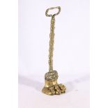 Brass door stop in the form of a lion paw, 38cm tall