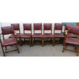 Set of eight oak panel back dining chairs including two carvers raised on turned supports