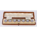 Set of seven 9ct gold, sapphire, mother of pearl and blue enamel buttons, each stamped 9c, 9.56g