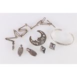 Contemporary silver jewellery suite comprising crescent moon brooch, bangle and pair of earrings,