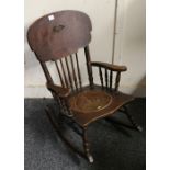 Arts and Crafts child's rocking chair with scroll arms and pokerwork seat, 68cm tall